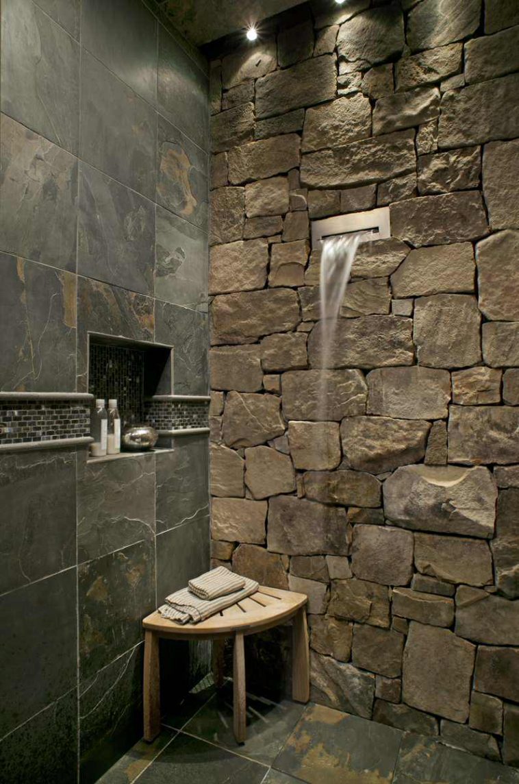 rustic-bathroom-ideas-with-slate-tile-and-stone-wall-with-waterfall-shower-and-shower-niche-plus-shower-bench-and-ceiling-lighting-with-mosaic-tile-accent-758x1144